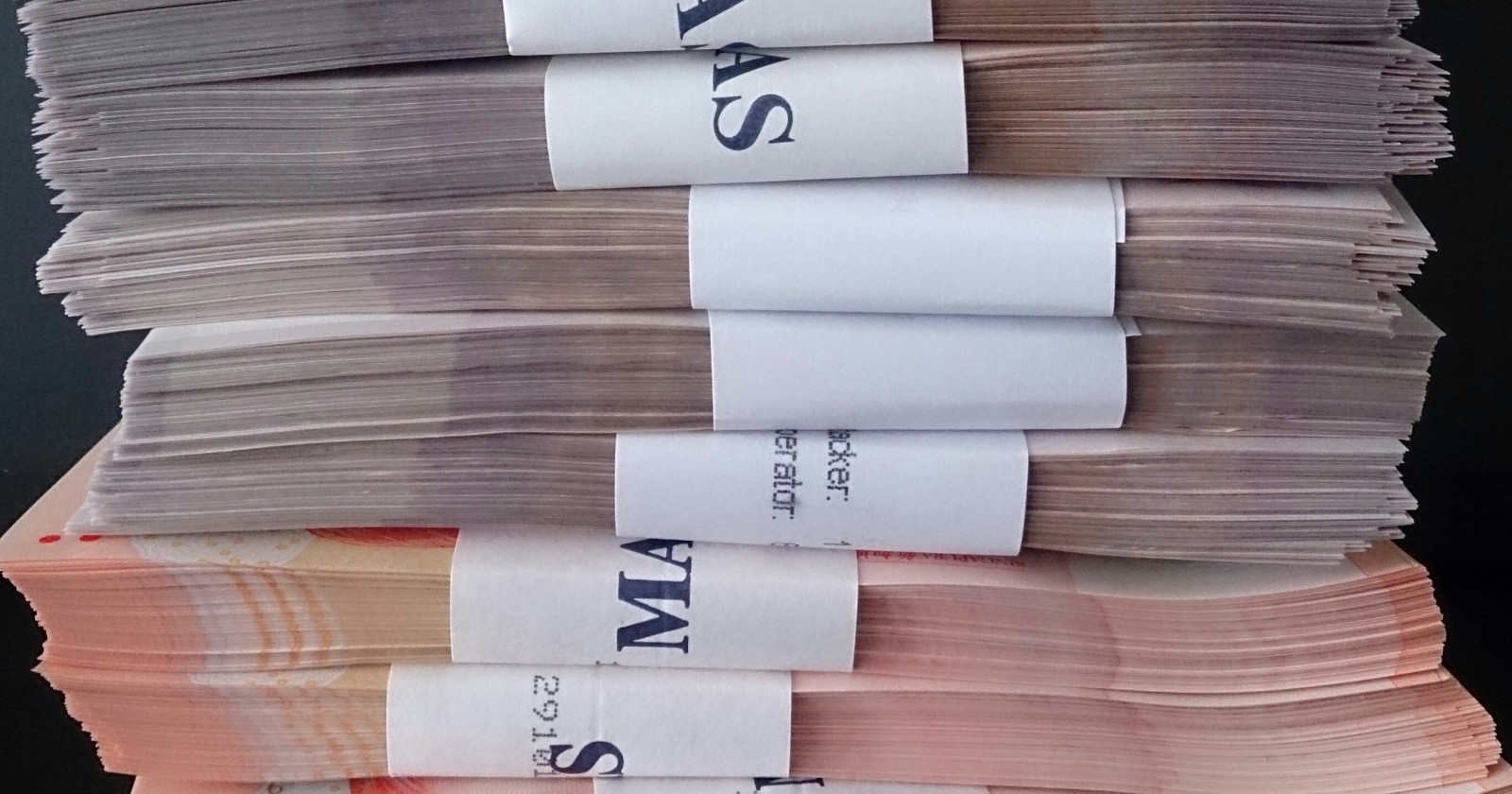 Bundled stacks of paper banknotes wrapped in bands