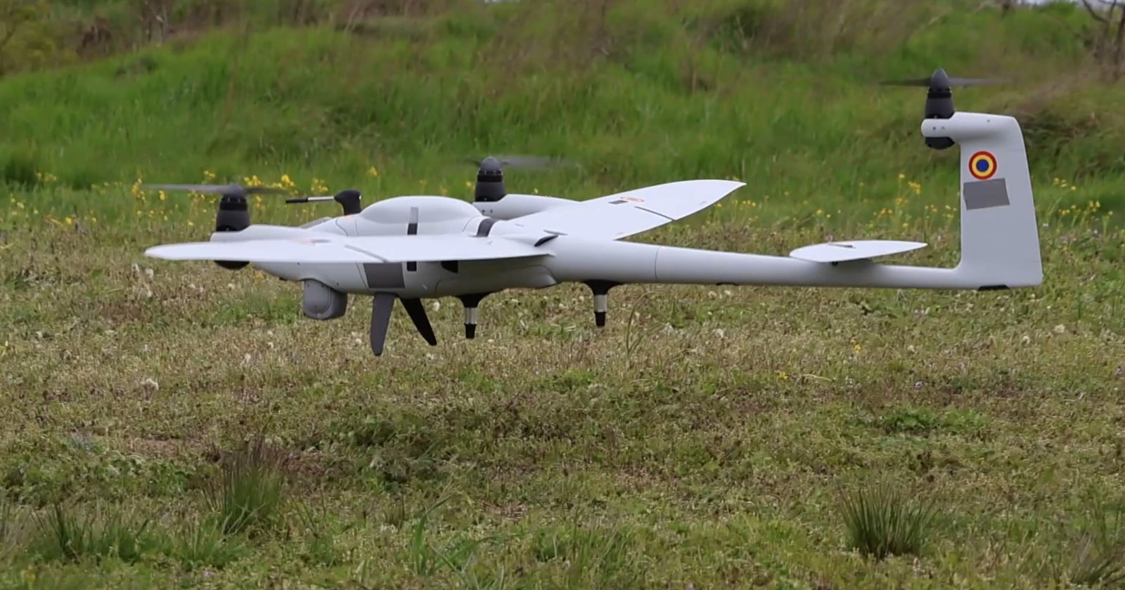 Quantum-Systems Vector drone in flight low over grass during the Eastern Phoenix 2026 exercise in Romania