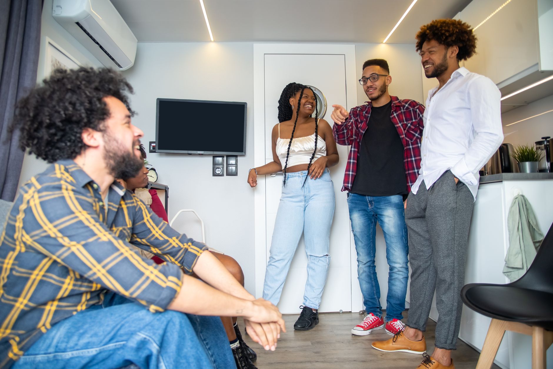 Representative group of adults talking together indoors
