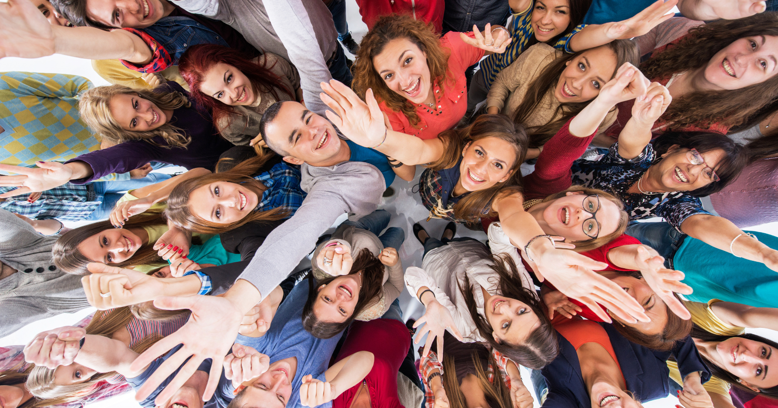 Diverse group reaching towards the camera