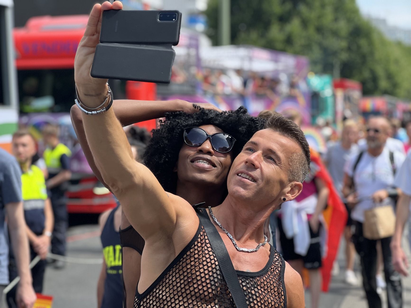 People taking a selfie at an outdoor event