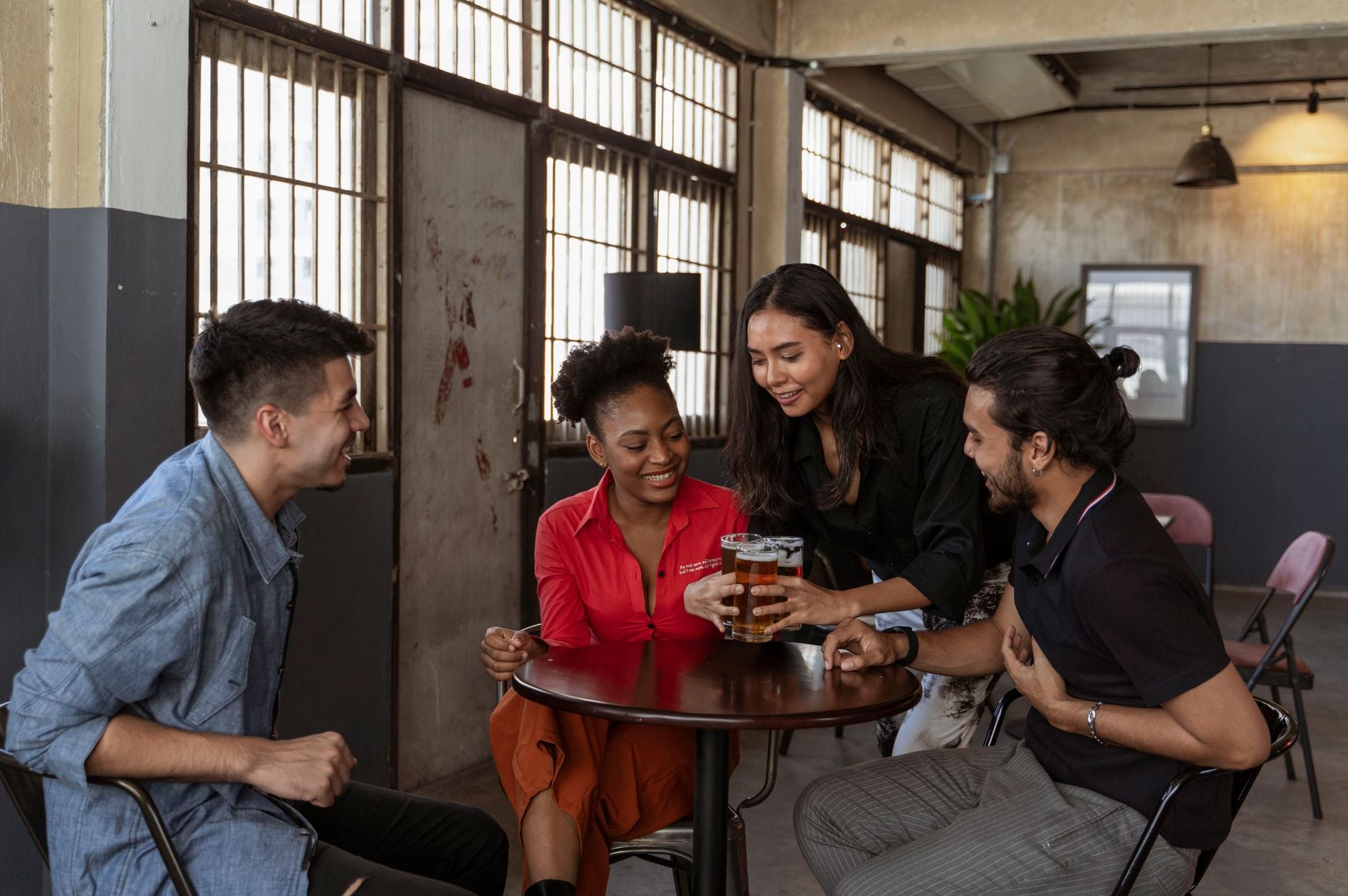 Representative group of adults socialising together indoors
