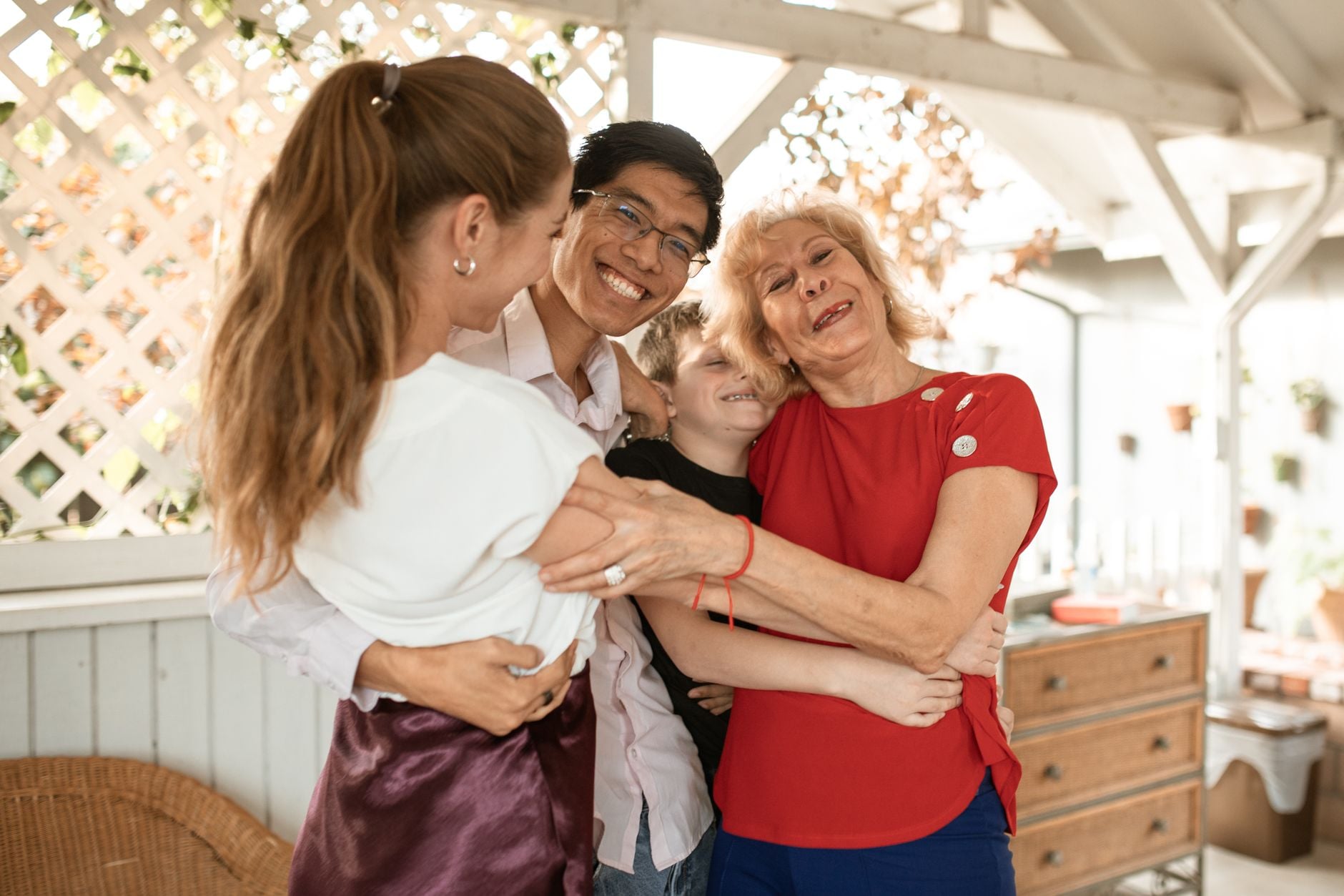 Multigenerational family hugging
