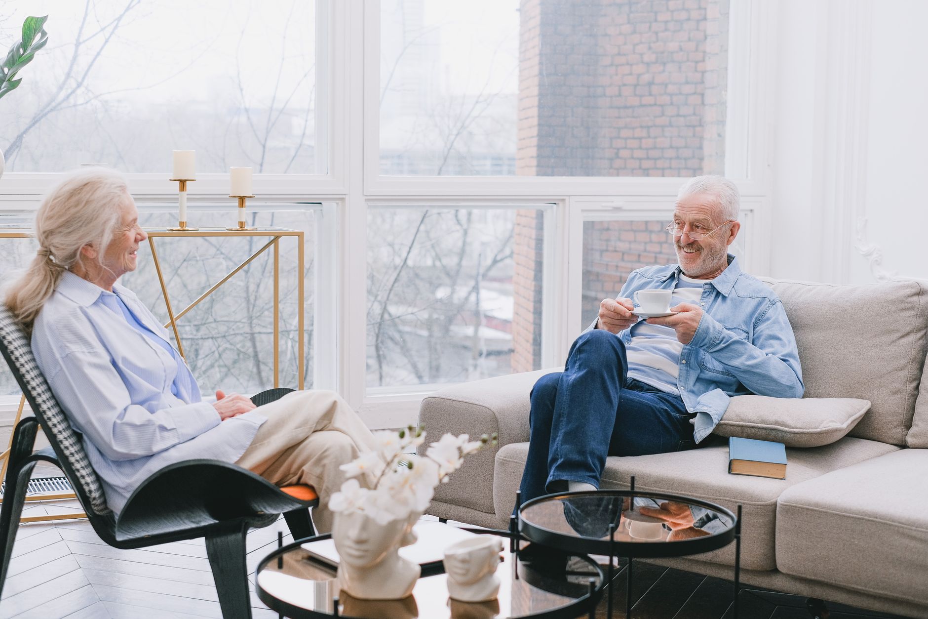 Representative older couple sharing a peaceful moment over tea at home
