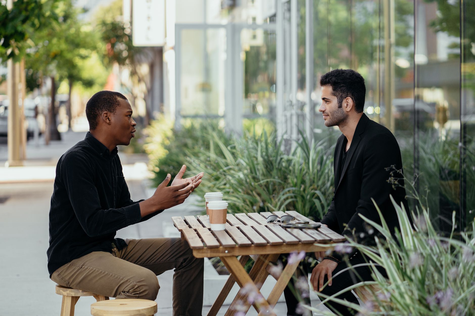 Two people having a calm conversation across a table