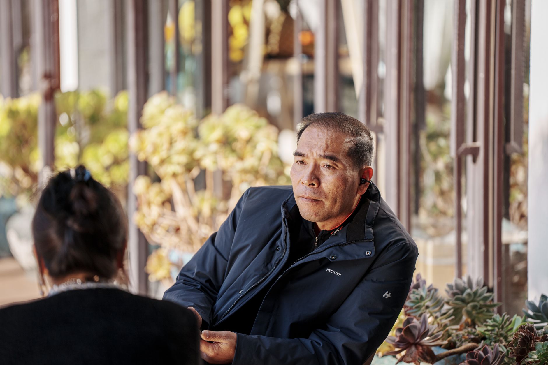 Two people sharing a thoughtful conversation outdoors