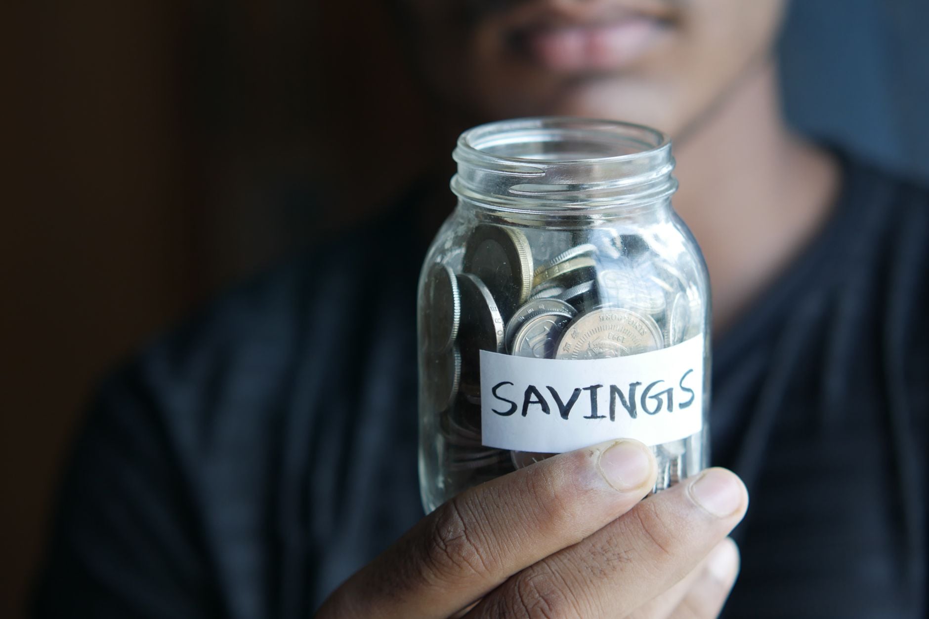 Glass jar labelled Savings