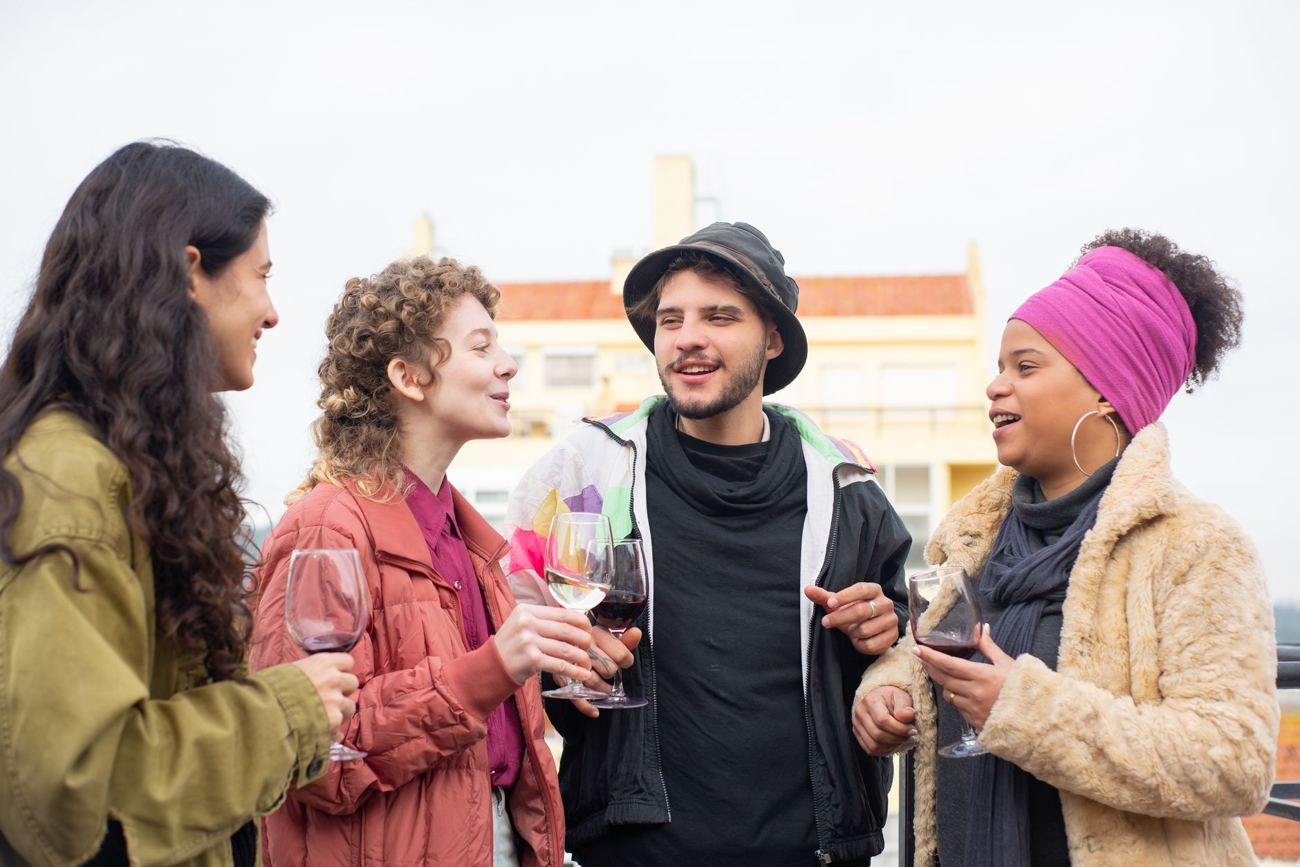 Four friends talking outdoors
