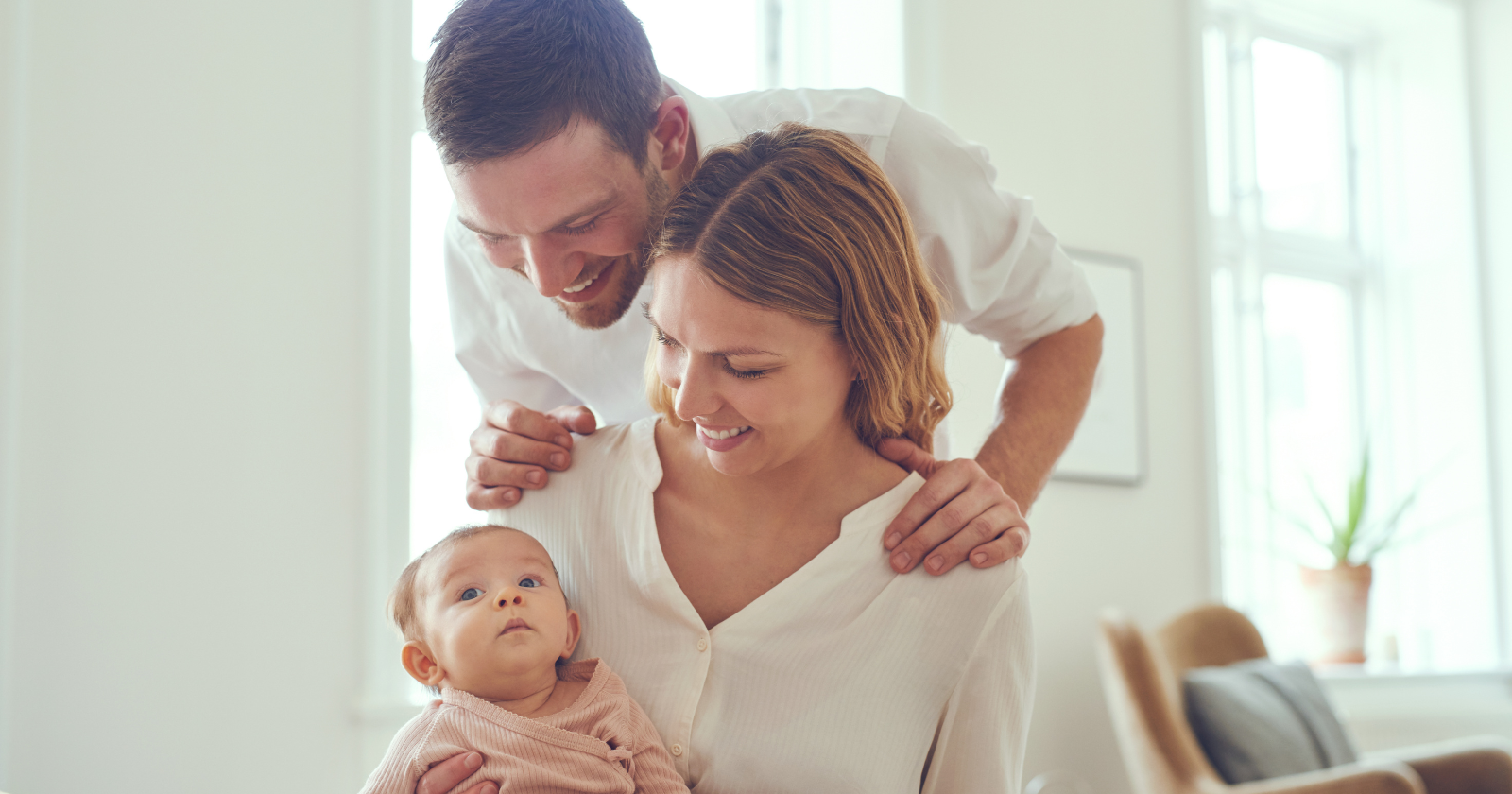 Parents sitting together with their baby