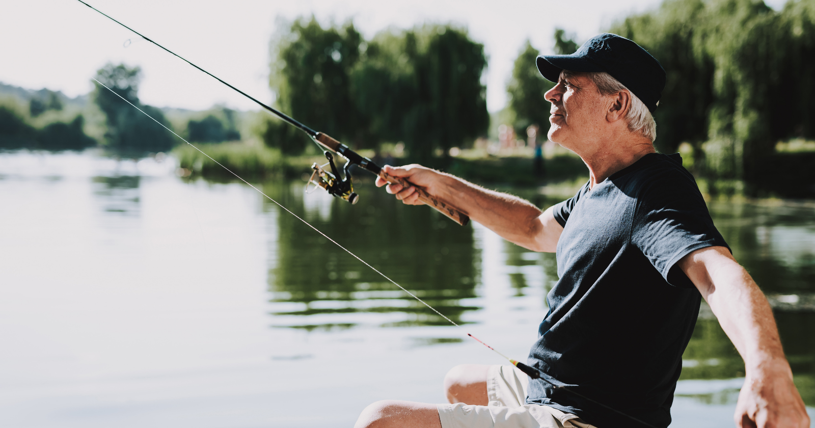 Older man fishing from a boat