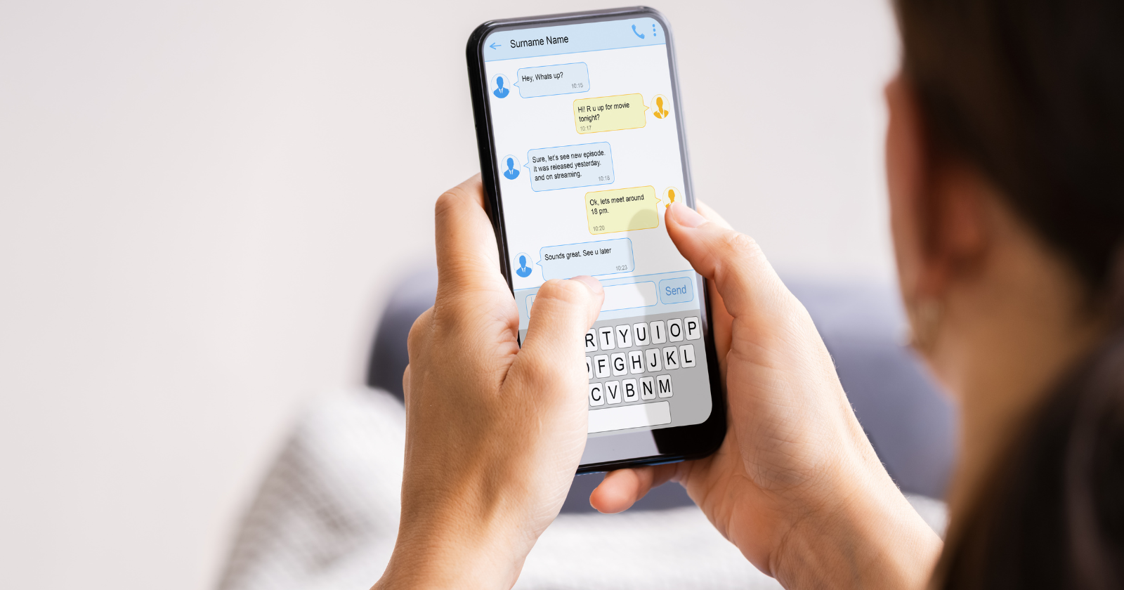 Person typing a message on a smartphone