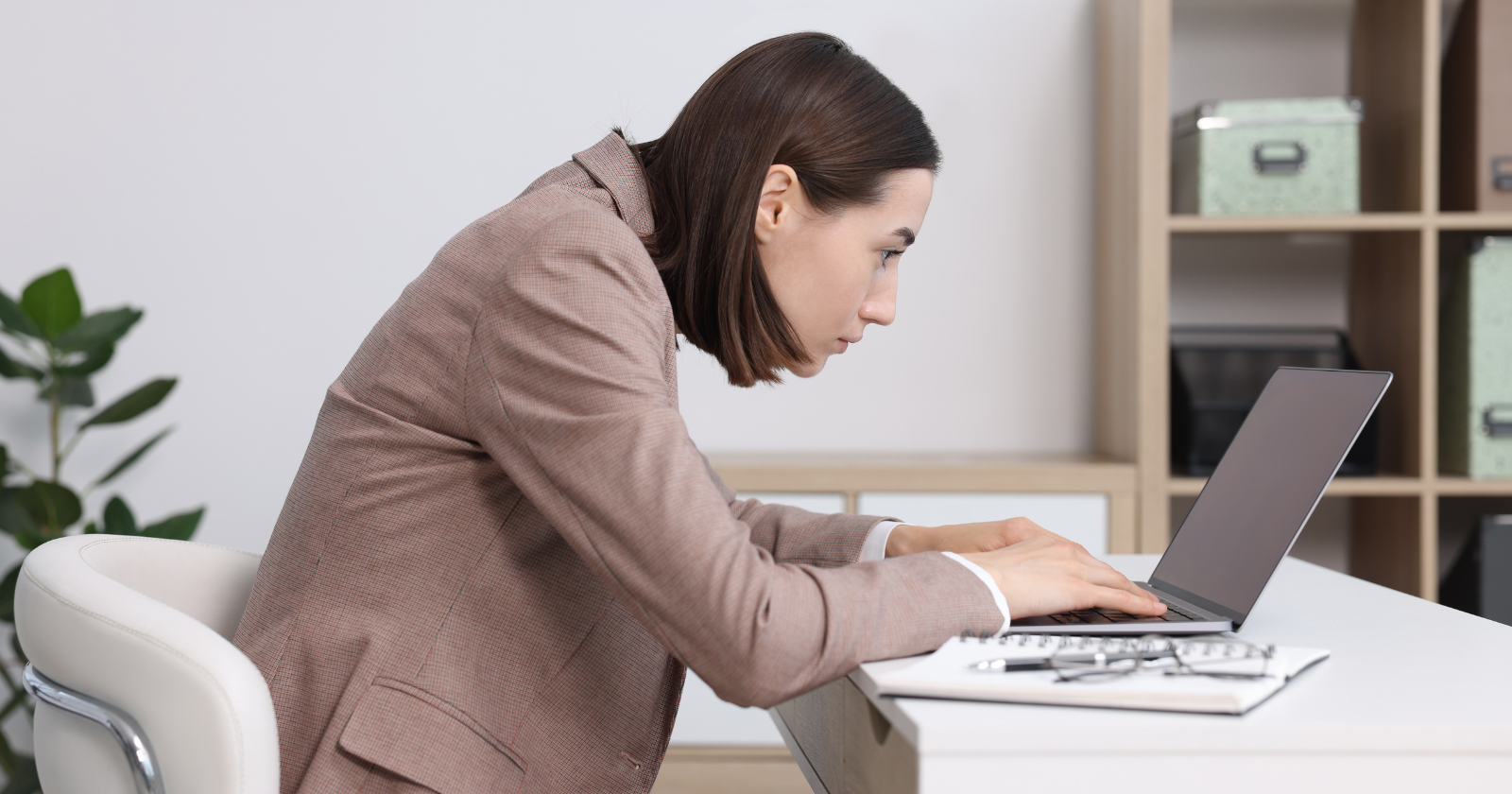 Woman concentrating on work at a laptop