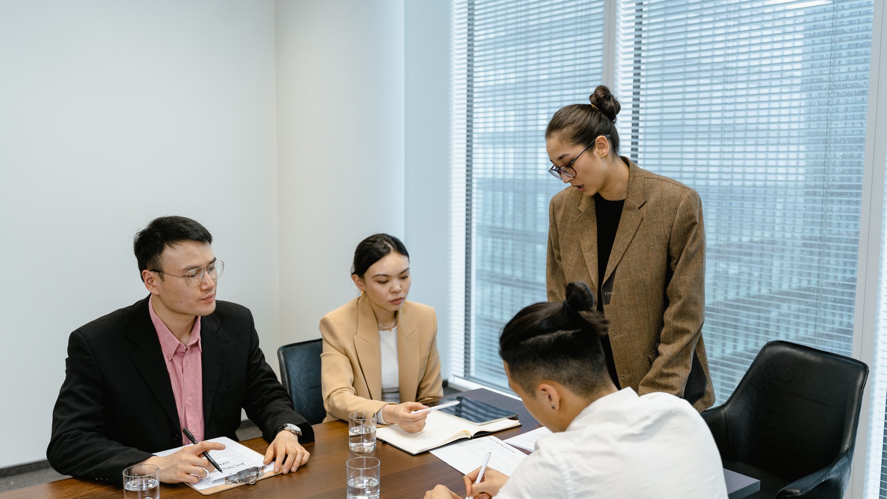 Four colleagues taking part in a workplace meeting