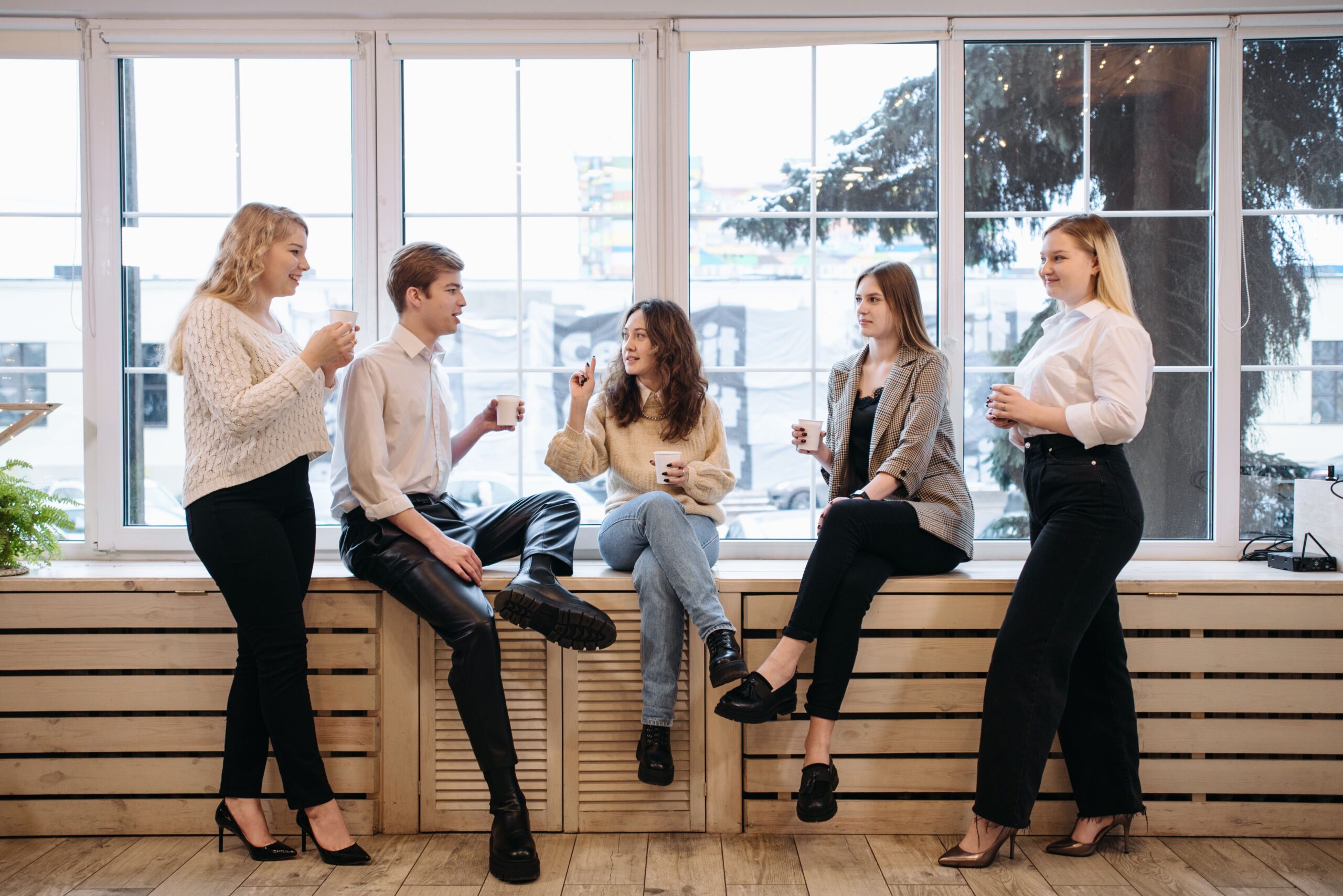 A group of colleagues talking together during a coffee break